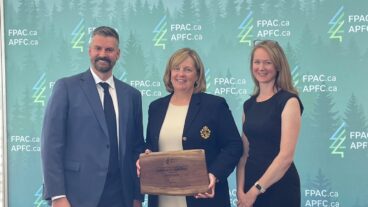 Domtar's Bonny Skene, center, receives an FPAC award as the 2023 Outstanding Member of the Year. Pictured left: Derek Nighbor, right: Kate Lindsay.