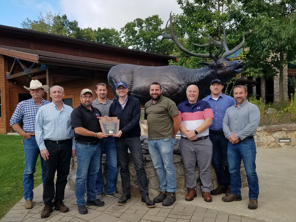 Image of group of men accepting a plaque award from the Keystone Elk Country Alliance in front of elk statue in wooded area. Our Johnsonburg Mill demonstrates our commitment to sustainability by partnering to restore Pennsylvania wildlife habitats.