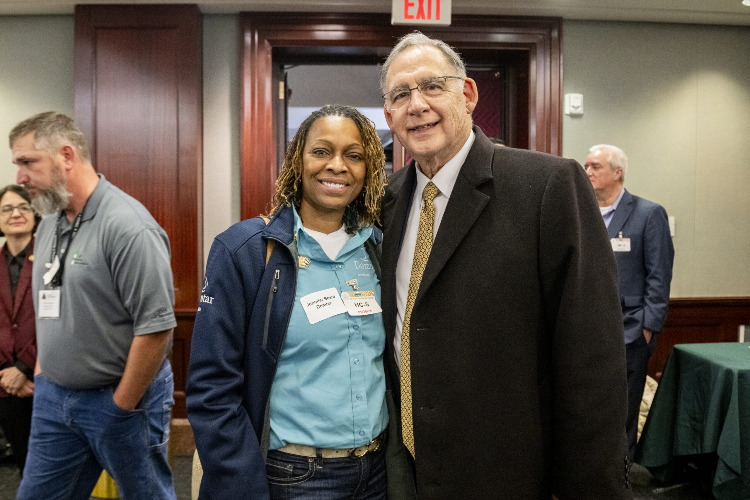 Industry advocates like Ashdown Mill employee Jennifer Beard met with lawmakers, including Senator John Boozman. Image description: Jennifer Beard, an Ashdown Mill employee (on the left), is pictured with Senator John Boozman on the right. They are in a room with other people in the background