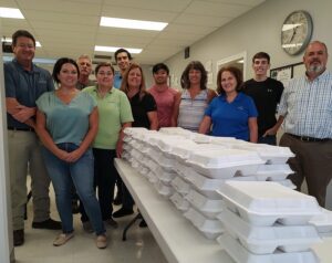 Marlboro Mill employees give back to their community regularly in several ways, including by serving food to neighbors at the Community Kitchen.