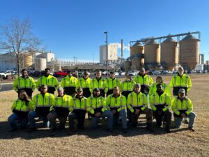 20 new employees in January 2024, pictured in front of the Marlboro Mill.
