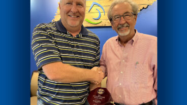 DeWayne Bone (left), ex-officio general chairman of the Pulp and Paper Safety Association’s board of directors, and Paper and Packaging’s senior director of health and safety, presents the PPSA Distinguished Service Award to Randy Adams, Kingsport Mill health and safety manager.