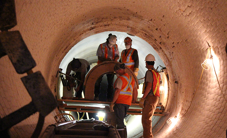 workmen in a tunnel