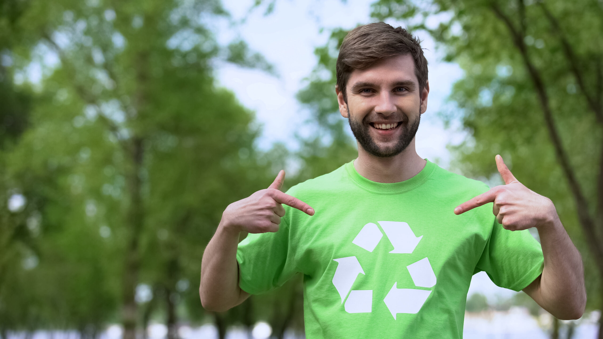 America Recycles Day man in green shirt with the recycle symbol