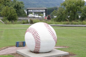 Domtar Park in Kingsport, TN with baseball statue in foreground.