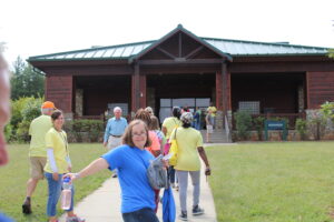 IMAGE: Campers entering a Camp Blue Skies overnight camp for adults with special needs. Domtar has helped finance inclusive recreation projects.